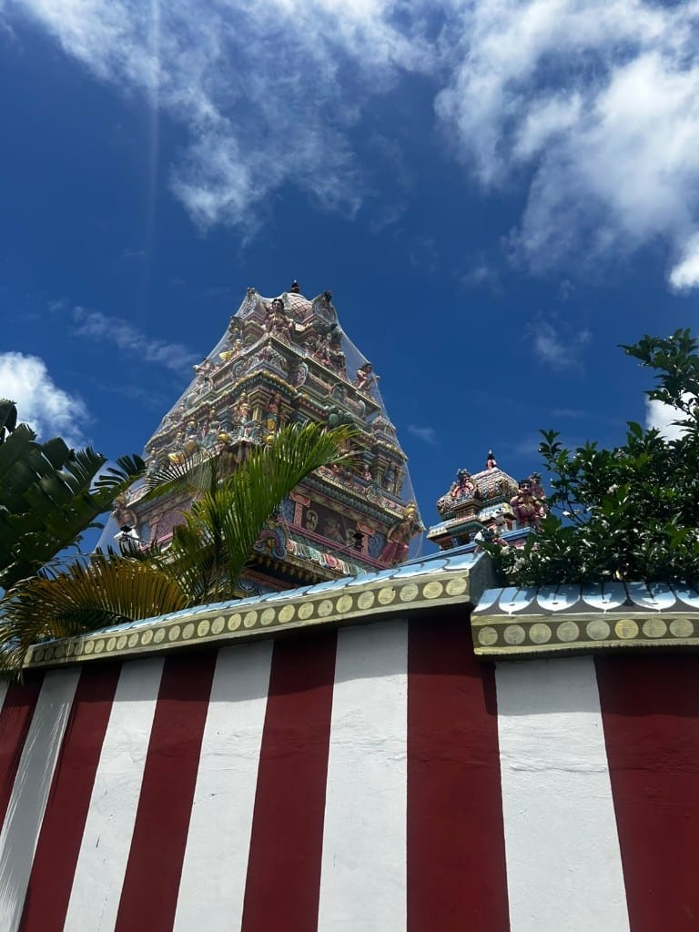 Tamil Surya Oudya Sangam Temple with protective netting over the tower, Grand Baie, Mauritius